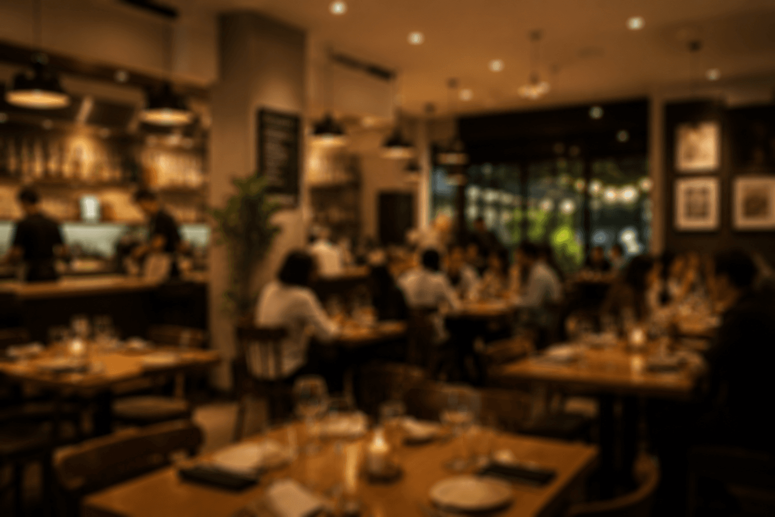 Warm restaurant dining room with guests at tables